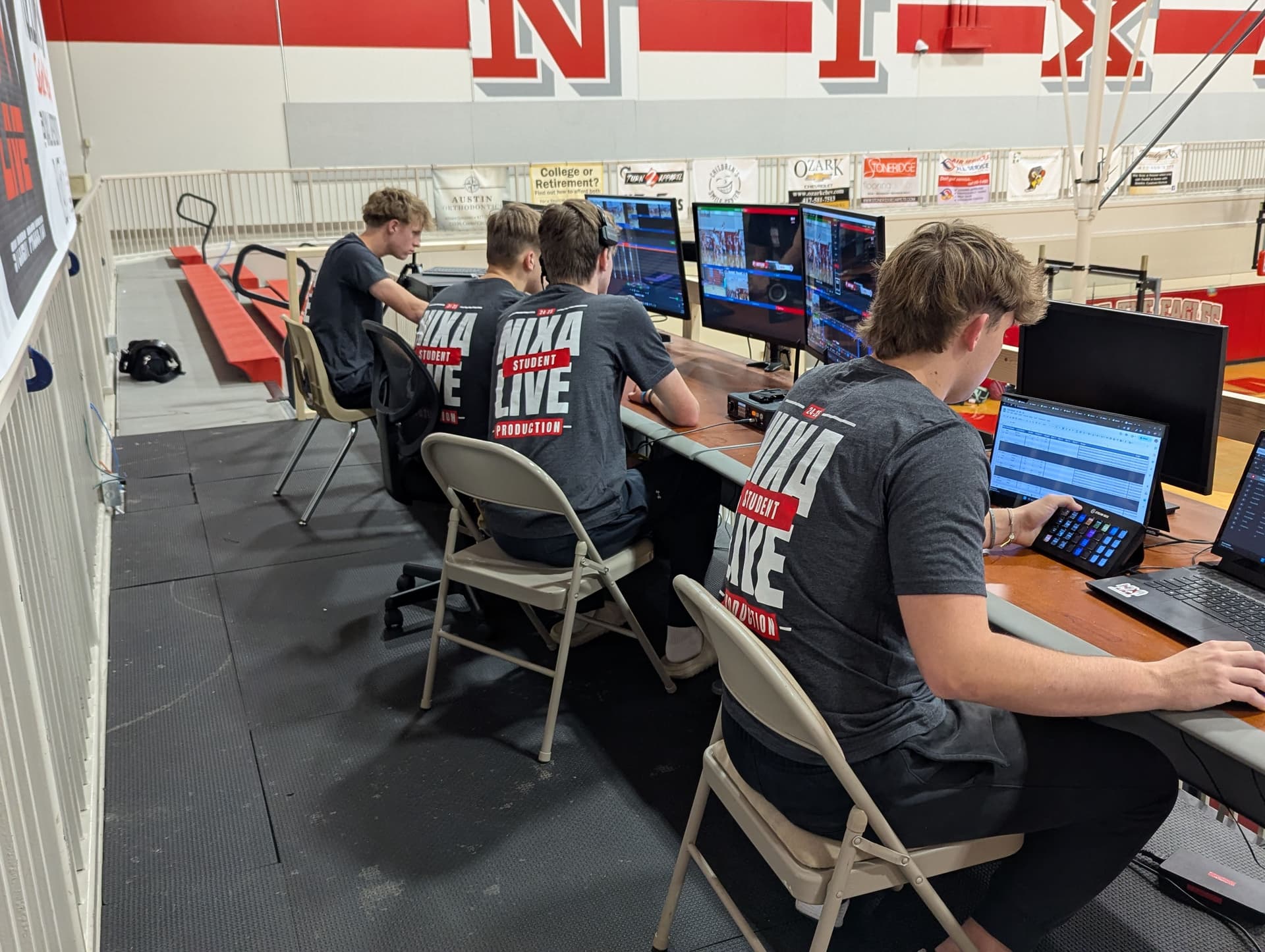 Nixa LIVE crew member directing replay and graphics in the control room